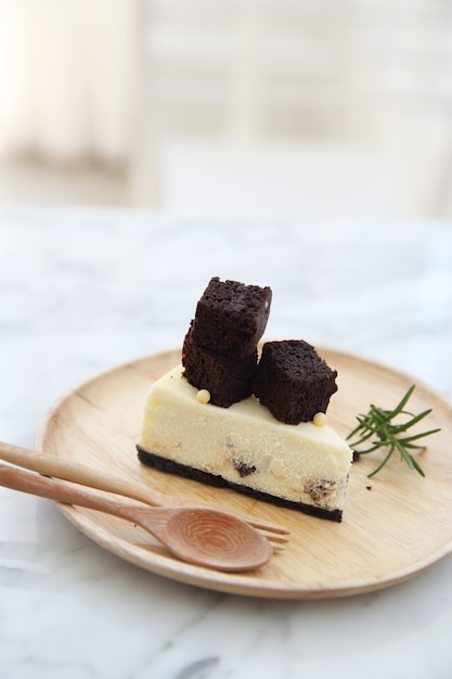 Brownie cheese cake on wood plate