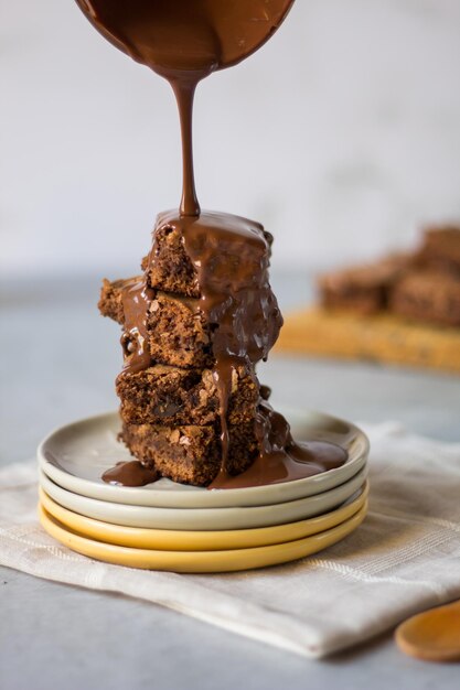 brownie with melted chocolate on a plate