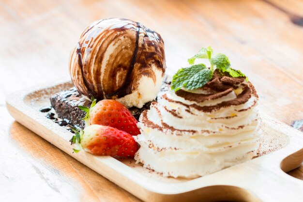 Brownies and ice cream in wood bowls 