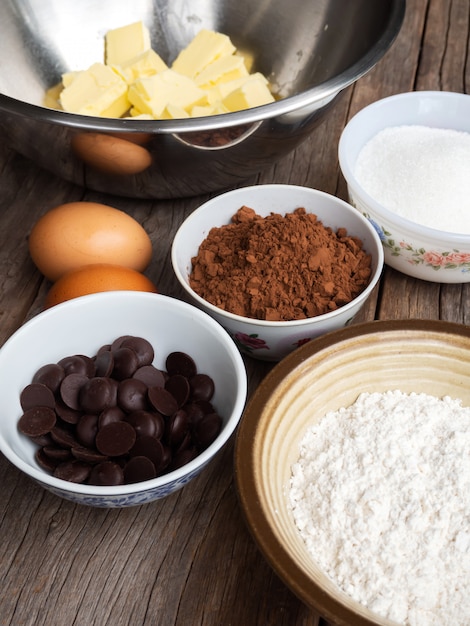 Brownies ingredients on wooden table. Top view with copyspace.