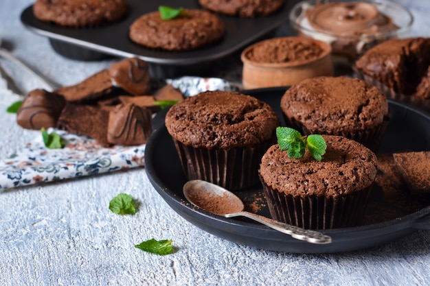  brownies with nuts and chocolate on a black background