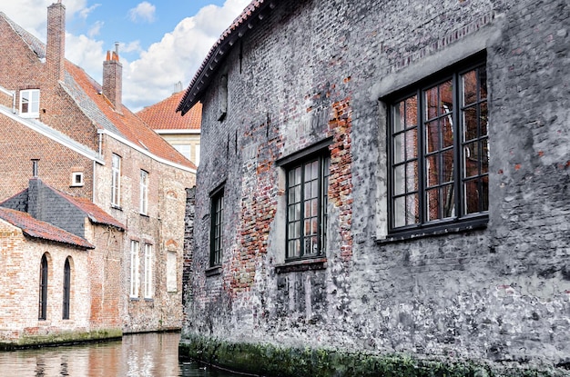 Bruges, Belgium view of the medieval buildings that are crossed by the canals of the city. Historic.