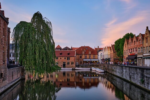 Bruges canal and houses at sunset Brugge famous place Belgium