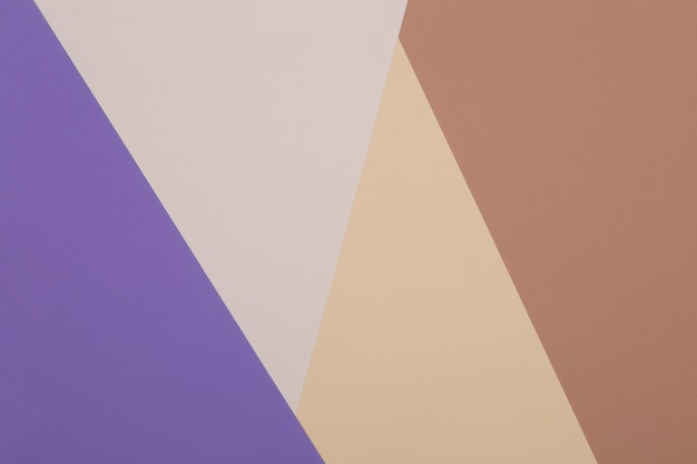 Bruine, paarse en gele achtergrond, gekleurd papier verdeelt geometrisch in zones