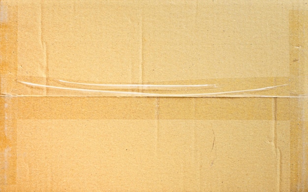 Bruine papieren doos of golfkarton blad met tape textuur