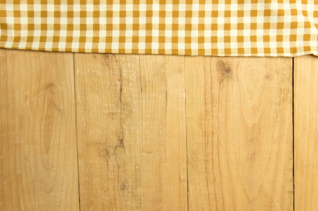 Bruine plaid op de houten achtergrond van de lijsttextuur