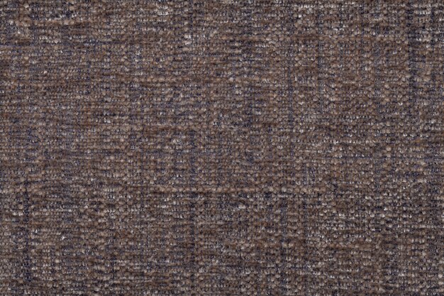 Bruine pluizige achtergrond van zachte, wollige doek. Het patroon van textiel close-up