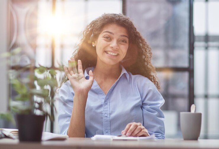 Photo brunette business woman using headset to communicate and advise people in customer service office