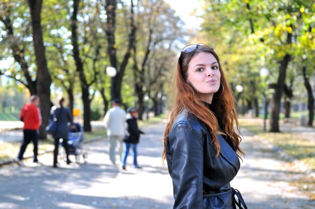 brunette Cute young woman posing outdoors in nature