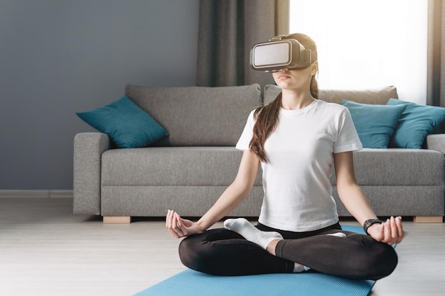 Brunette girl meditating in lotus yoga pose