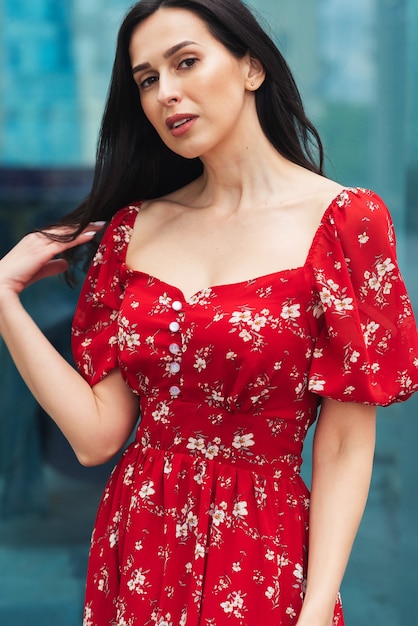 brunette girl posing at city street Pretty beautiful business woman in elegant dress city background