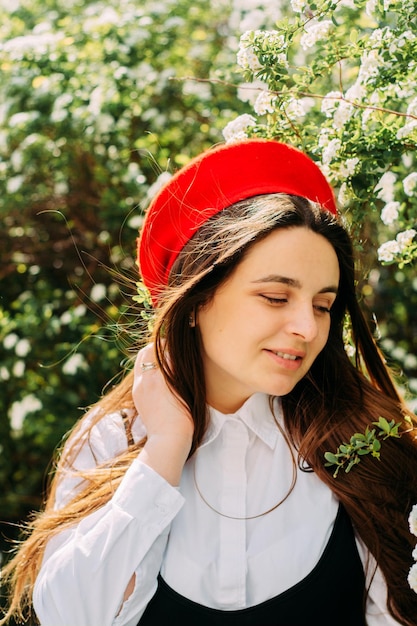 A brunette girl in a red beret