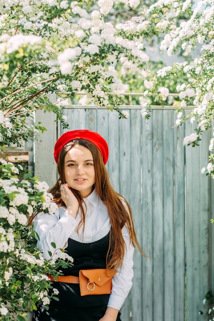 A brunette girl in a red beret