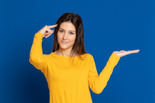 Brunette girl wearing a yellow T-shirt