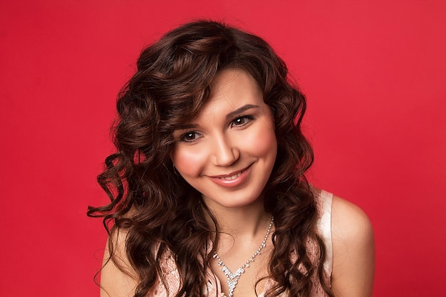 Brunette girl with wavy hair very joyful and happy smiling with teeth