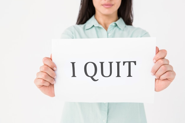 Brunette holding i quit card 