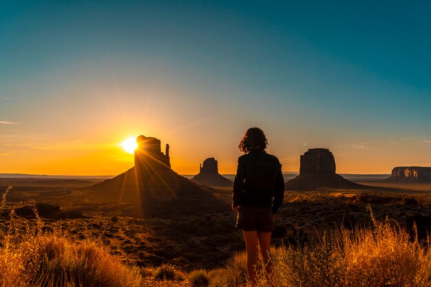 A brunette lifestyle girl at dawn in Monument Valley, Utah