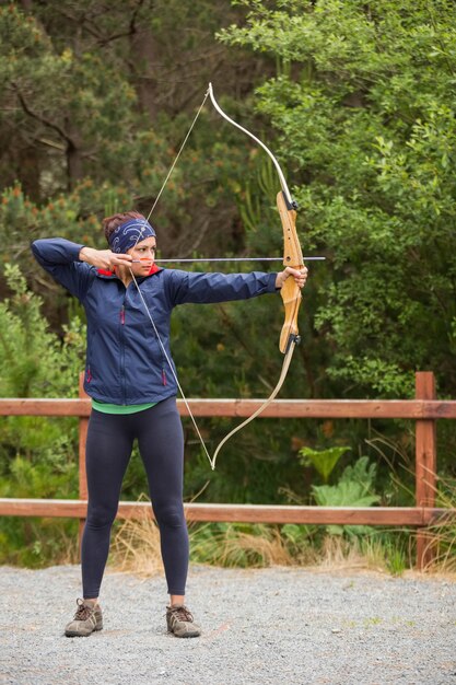 Brunette practicing archery