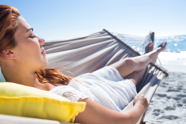 Brunette relaxing in the hammock