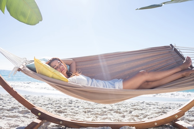 Brunette relaxing in the hammock