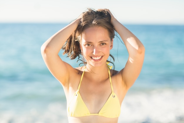 Brunette relaxing and smiling at camera