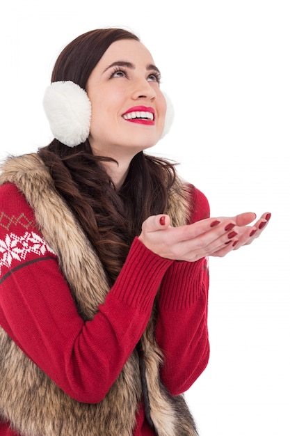 Brunette in winter clothes with hands out