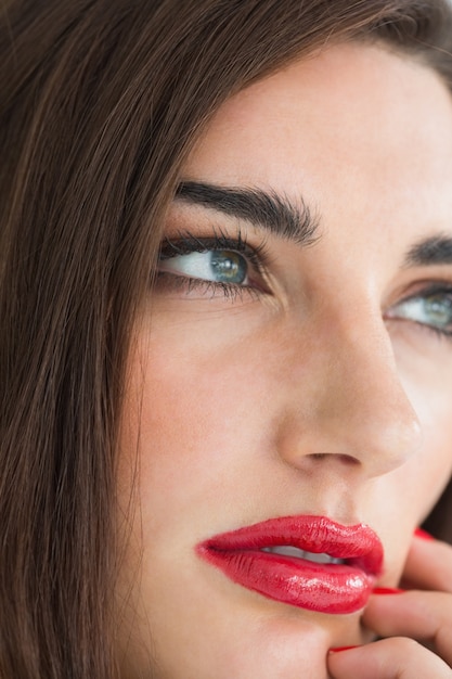 Brunette with red lips and nails