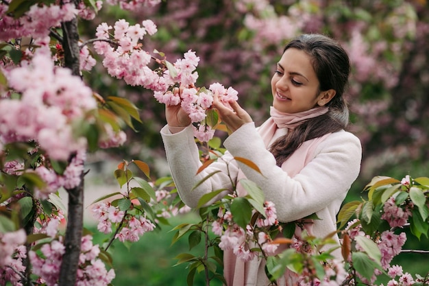 Brunette woman enjoying spring day in park