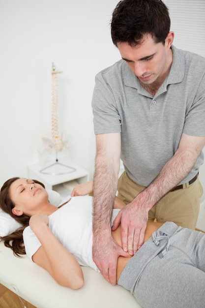 Brunette woman having a stomach ache