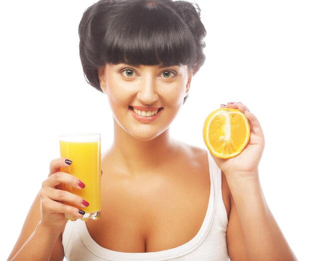 Brunette woman holding orange juice