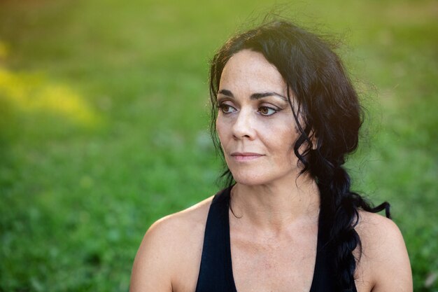 Brunette woman in a park