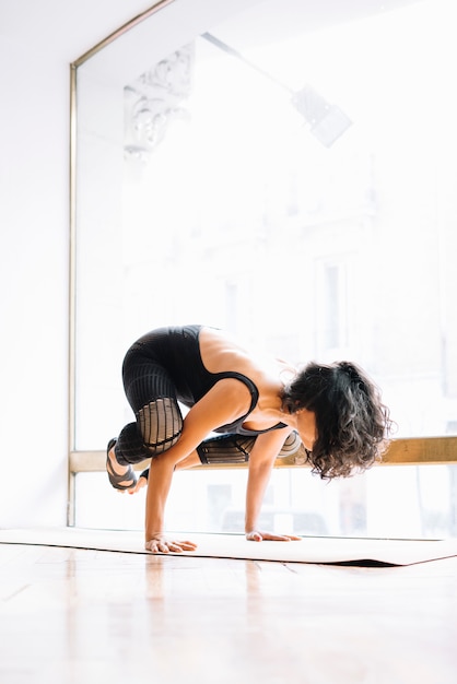 Brunette woman practicing yoga