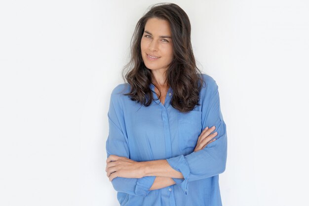 Brunette woman standing on white 