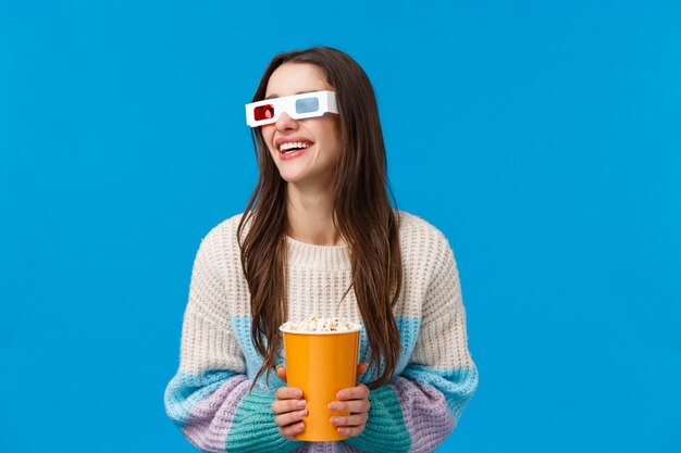 brunette woman with 3d glasses and popcorn