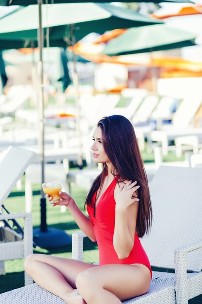 Brunette woman with a glass of juice 