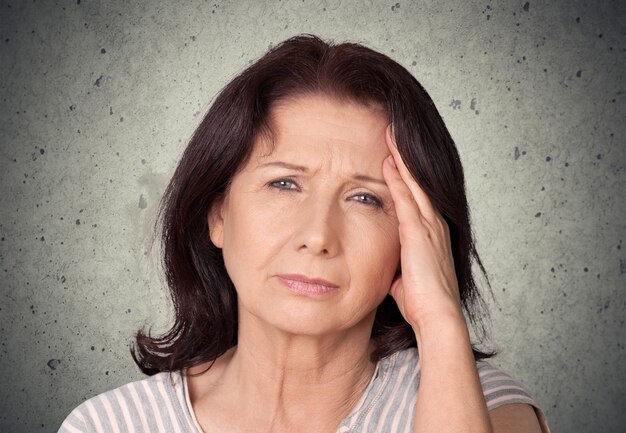 Brunette woman with pain in head