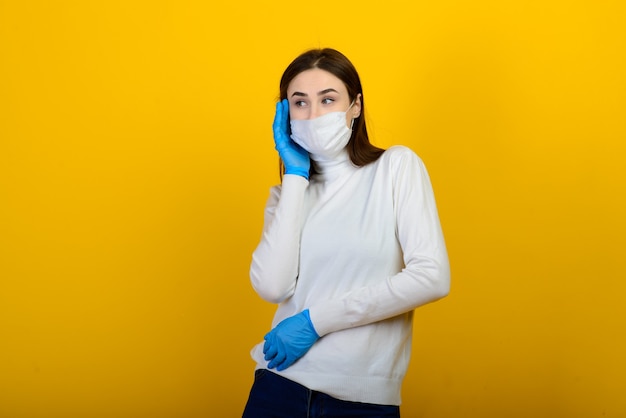 Brunette woman with protective mask and gloves