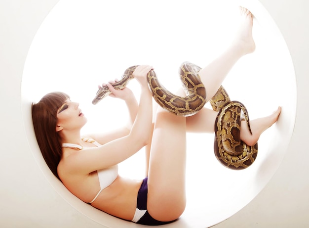 Brunette woman with python