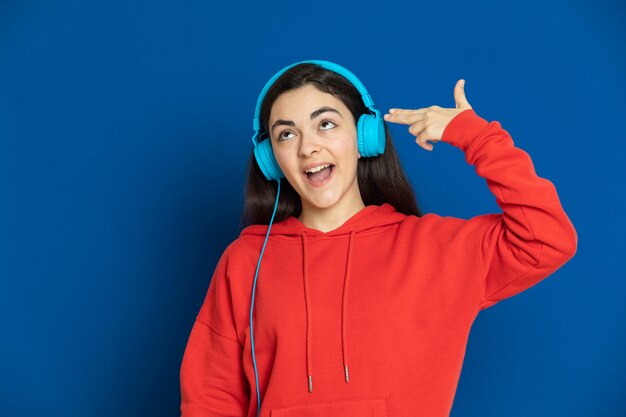 Brunette young girl wearing red sweatshirt