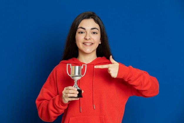 Brunette young girl wearing red sweatshirt