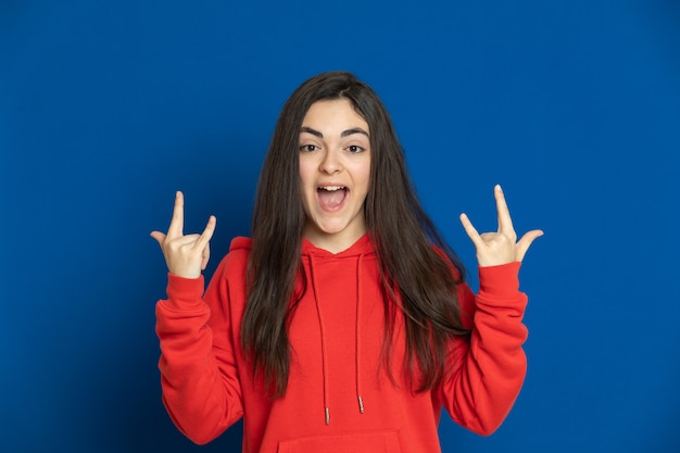 Brunette young girl with a red sweatshirt