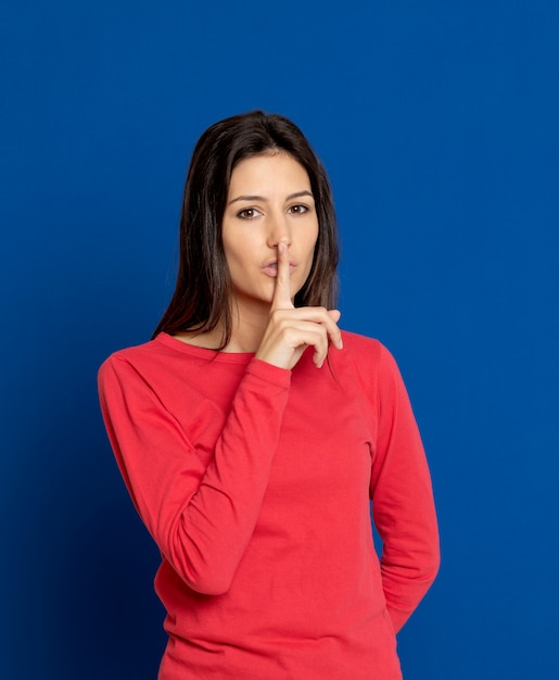 Brunette young woman wearing a red T-shirt