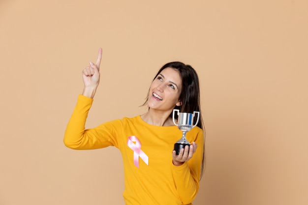 Brunette young woman wearing a yellow T-shirt