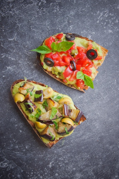 Bruschetta on a dark back, Assorted bruschetta, Top view