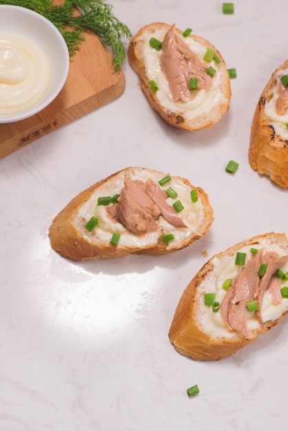 Bruschetta. Sandwich tuna fish salad on wooden background