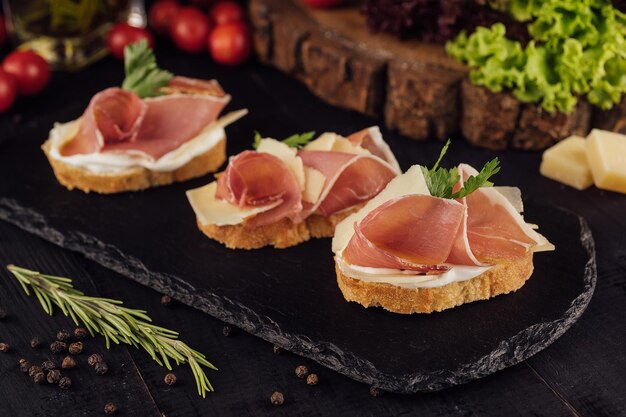 Bruschetta set with parma ham and parmesan cheese