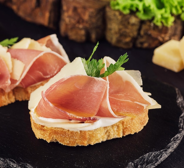 Bruschetta set with parma ham and parmesan cheese