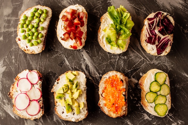 Bruschetta or traditional spanish tapas on a dark background