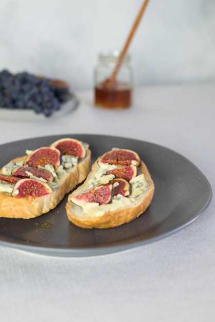 Bruschetta with blue cheese and fresh figs and honey