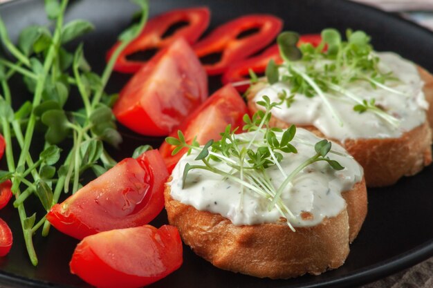 Bruschetta with cheese microgreens and vegetables